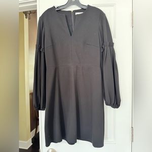 Black cotton tibi dress with fitted then puff long sleeve v-neck